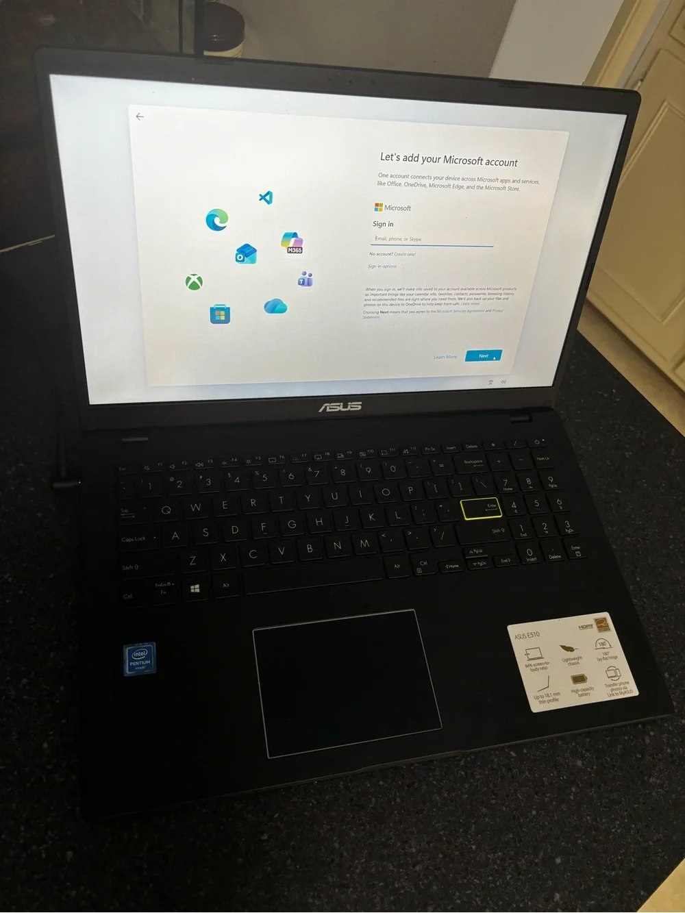 ASUS Black Laptop with Yellow-Accent Key